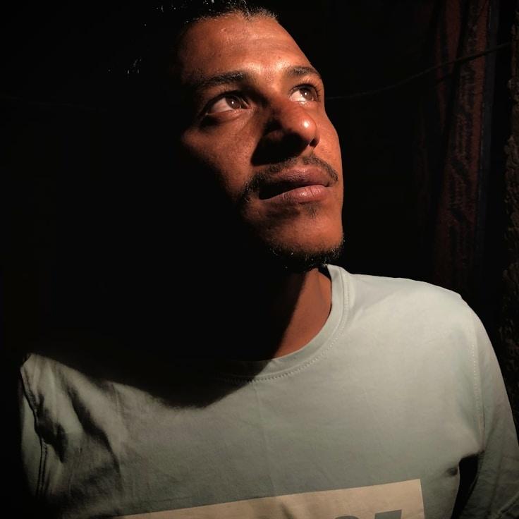 Aisha Kapoor, Lead Design Curator at CloverdAppleWind, reviewing corporate floral arrangements